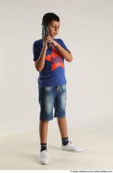 TIMBO STANDING POSE WITH GUN